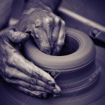 18744454-Hands-working-on-pottery-wheel-close-up-retro-style-toned-photo-wit-shallow-DOF-Stock-Photo